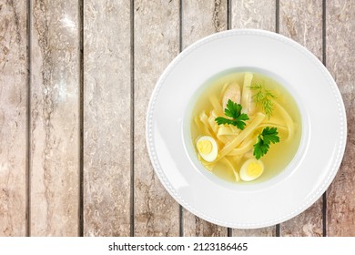 Tasty Noodle Soup With Vegetables In Bowl On The Desk