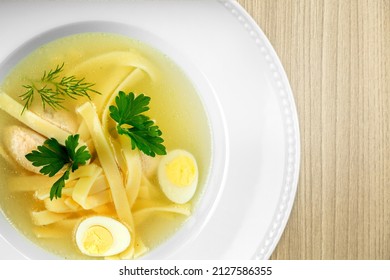 Tasty Noodle Soup With Vegetables In Bowl On The Desk