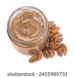 Tasty nut paste in jar and walnuts isolated on white