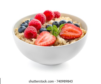 Tasty oatmeal with berries in bowl on white background - Powered by Shutterstock