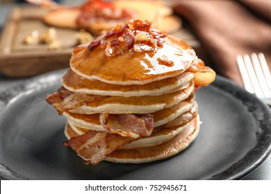 Tasty Pancakes With Bacon On Plate