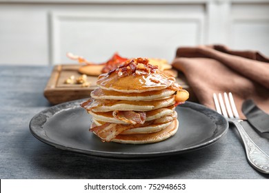 Tasty Pancakes With Bacon On Plate