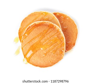 Tasty pancakes with maple syrup on white background, top view