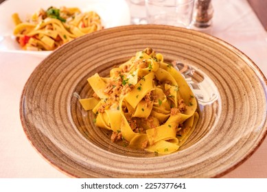 Tasty pasta dish in alfresco Italian restaurant  - Shutterstock ID 2257377641