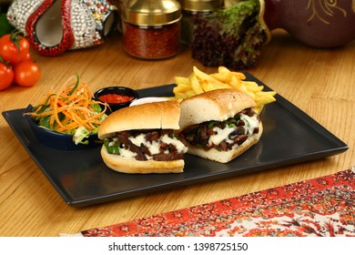 Tasty Philly Beef Steak Sandwich with melted cheese and french fries