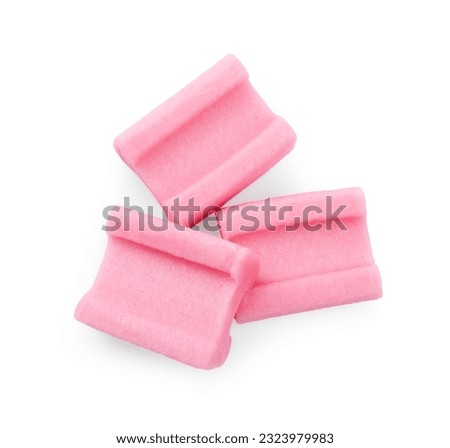 Tasty pink chewing gums on white background, top view