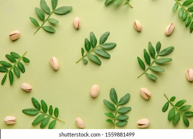 Tasty Pistachio Nuts On Color Background