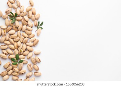 Tasty Pistachio Nuts On White Background