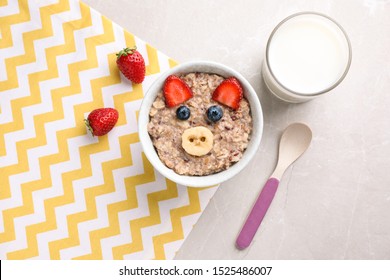 Tasty Porridge Served With Berries And Milk On Marble Table, Flat Lay. Creative Idea For Kids Breakfast