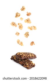 Tasty Protein Bars And Granola Falling On White Background