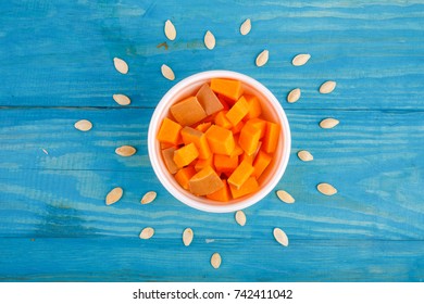 Tasty pumpkin on the blue background. Food concept.