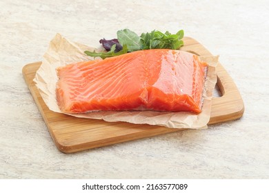 Tasty Raw salmon fillet over board