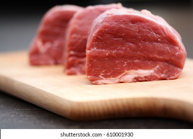 Tasty Raw Veal Or Beef Meat On Wooden Cutting Board