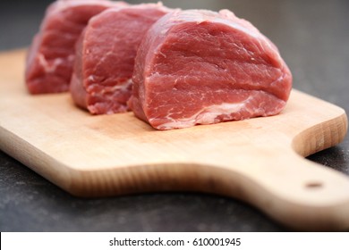 Tasty Raw Veal Or Beef Meat On Wooden Cutting Board