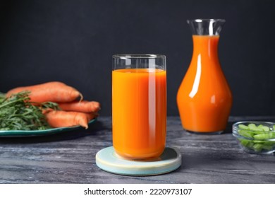 Tasty Refreshing Carrot Juice On Black Marble Table