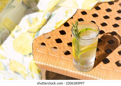 Tasty Refreshing Lemonade On Wicker Bench, Space For Text. Summer Drink