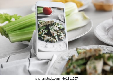 Tasty Salad And Cellphone. Food Blog Concept