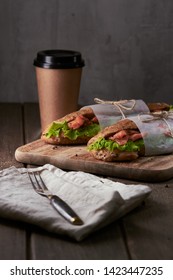 Tasty salmon sandwich with coffee