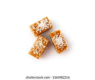 Tasty Salty Caramel Candies On White Background