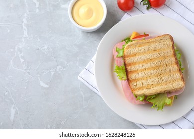 Tasty Sandwich With Ham On Grey Table, Flat Lay. Space For Text