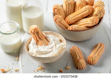 Tasty Shortbread Cookies Served With Whipped Cream On White Table