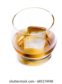 Tasty Single Malt Scotch Whiskey Served With A Large Ice Cube Isolated On A White Background