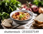 Tasty soup or stew made of beef tripe and spices. Spicy and aromatic tripe soup seasoned with pepper and served with bread.