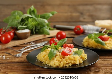 Tasty Spaghetti Squash With Tomatoes And Basil Served On Wooden Table