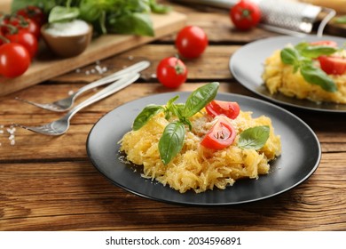 Tasty Spaghetti Squash With Tomatoes And Basil Served On Wooden Table