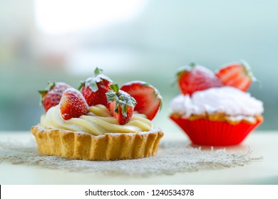 Tasty tartlets with whipped cream and fresh strawberries. Pastry. Sweet dessert 
