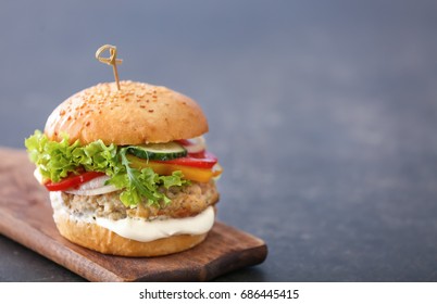 Tasty Turkey Burger On Wooden Board