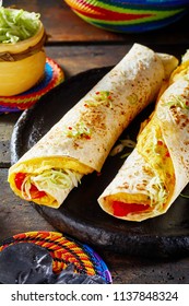 Tasty Ugandan Street Food With Two Vegetarian Rolex Rolls Made From Egg Omelette And Diced Fresh Tomatoes And Cabbage Wrapped In A Chapati