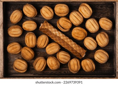 Tasty walnut shaped cookies with boiled condensed milk and sweet tube with condensed milk