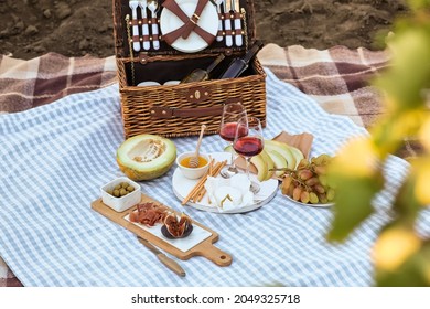 Tasty wine and snacks for romantic picnic in park - Powered by Shutterstock