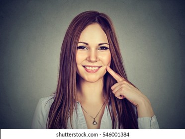 Its Tasty. Woman With It Tastes Good Gesture Isolated On Gray Wall Background. Human Emotion Body Language