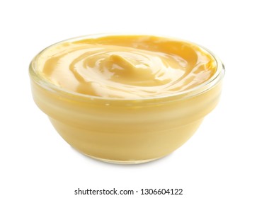 Tasty Yellow Sauce In Bowl On White Background