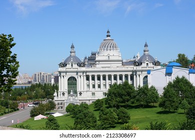 Tatarstan, Russia July 21 2021 - View of beautiful green park and Farmers Palace (Ministry of Environment and Agriculture) in Kazan city center. This place is landmark of Kazan.