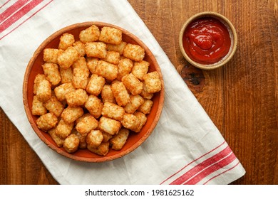 Tater tot potatoes with ketchup on the side - Shutterstock ID 1981625162