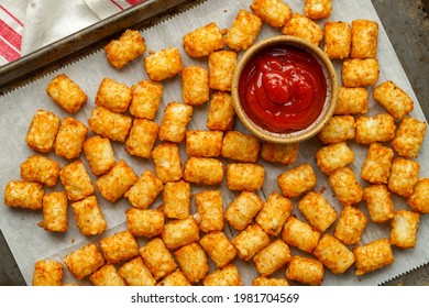 Tater tot potatoes with ketchup on the side - Shutterstock ID 1981704569