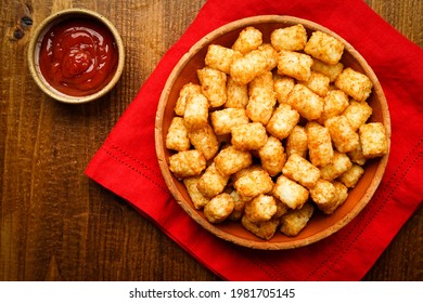 Tater tot potatoes with ketchup on the side - Shutterstock ID 1981705145