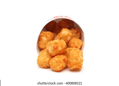 Tater Tots In A Containter On A White Background 