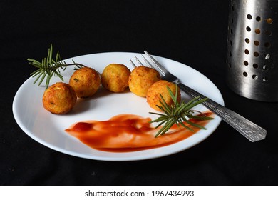 Tater Tots, With Ketchup And Rosemary .