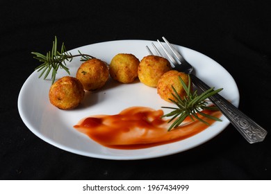 Tater Tots With Ketchup And Rosemary .