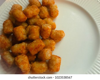 Tater Tots On A White Plate.