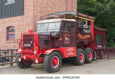 Taton Park, Knutsford, Cheshire, England, UK - May 27 2014: 1955 Scammell Explorer Lorry Housing A Steam Generator For The Victorian Gallopers Fairground Attraction