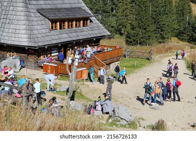 TATRA MOUNTAINS, POLAND - OCTOBER 3, 2015: Tourists Visit Hala Kondratowa Hostel In Tatra Mountains, Poland. Tatra National Park Was Visited By 2.7 Million People In 2013.