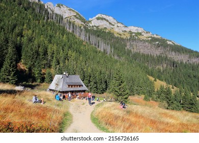 TATRA MOUNTAINS, POLAND - OCTOBER 3, 2015: Tourists visit Hala Kondratowa hut in Tatra Mountains, Poland. Tatra National Park was visited by 2.7 million people in 2013.