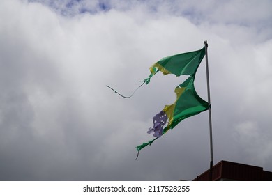 Tattered Flag Of Brazil, No Order And Also No Progress As In The Inscription Of The Banner (Ordem E Progresso)