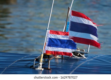 Tattered Thai Flags On A Motorboat In Bangkok, Thailand