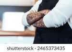 Tattoo, artist and art on skin from studio, parlor business owner with arms crossed in pride. Tattooist, shop and person with confidence from creative ink design and permanent body modification